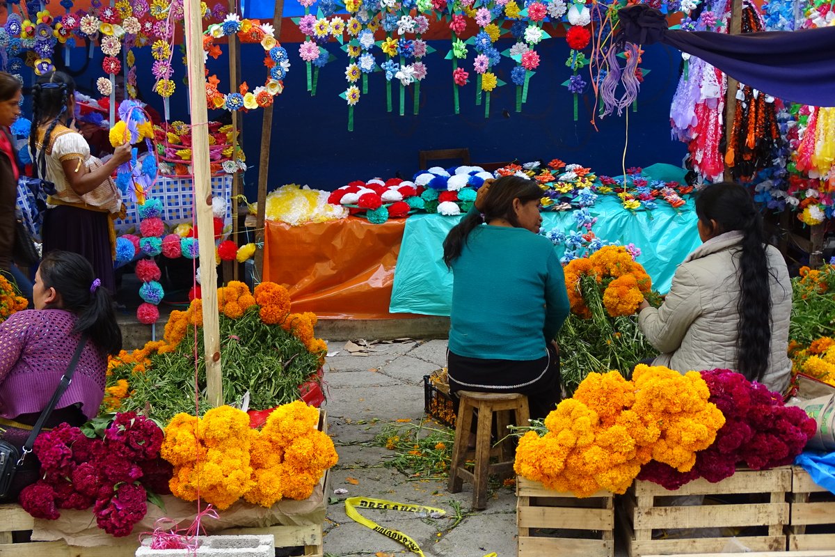 Vibrant Mexican street food market with colorful stalls